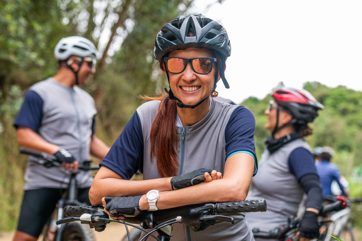 Scenic view of a family enjoying a bike ride on a lush trail in McAllen Texas, highlighting the city's commitment to outdoor fitness and historical exploration.
